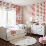 Confetti Bloom Wallpaper with colorful polka dots pattern covering a girl's bedroom wall.