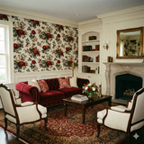 Floral Briarberry Parlour Wallpaper with red roses, set in a classically decorated parlor-style room.