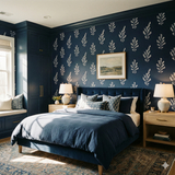Navy sprig wallpaper with foliage pattern, and a blue, fully furnished bedroom scene.