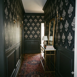 Blackwater Brocade Wallpaper with damask pattern on the walls of a hallway.