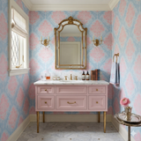 Blush wallpaper with a floral damask pattern in pink and blue tones.