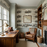 Fleetwork wallpaper with a boat and harbor pattern, over a wooden desk and leather chair.