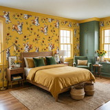 Yellow wallpaper with a floral and dog pattern from Soleil & Scout, adorning a bedroom.
