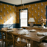 Dog-patterned wallpaper with yellow background, no brand attribution, featuring repeated illustrations of seated golden doodle dogs.
