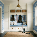 Westies wallpaper with a dog pattern on blue background.