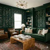 Veridian Apothecary Wallpaper with a floral pattern over dark green, styled in a living room.