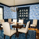 Westies themed wallpaper with blue and white pattern, featuring repeating dog and butterfly motifs.