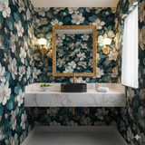 Nightgarden Magnolia Wallpaper with floral pattern on walls and a vanity with a black sink.
