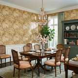 Golden Aviary Wallpaper featuring bird and branch patterns, creating a warm and inviting atmosphere.