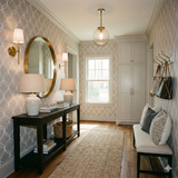 Patterned wallpaper by York Wallcoverings in a beige hue with a white lattice design.
