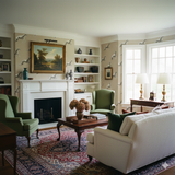 Patterned wallpaper by Dash & Form featuring a cream background with grey running dog illustrations.