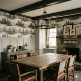 Misted Pines Inlet Wallpaper with a forest landscape pattern behind a wood dining table.
