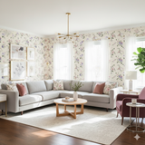 Floral Briar Lane Wallpaper with purple and pink flowers, covering a bright living room.