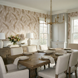Beige wallpaper with a feather-like pattern, and a complementing neutral dining set.