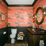 Campfire Solstice wallpaper with skeleton and campfire pattern, covering a rustic, Western-style bathroom.
