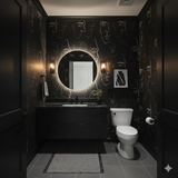 Black wallpaper with face pattern design, by Lioré, in a powder room setting.

