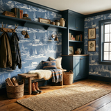 Blue Tundra Pinescape Wallpaper with winter cabin pattern, a shelf with books, and vintage accessories.
