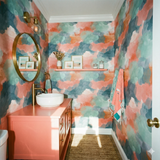 Harlow Drift Wallpaper with watercolor pattern from Wallshoppe, in hues of coral, teal, and blue, creating a modern, artistic aesthetic.
