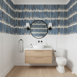 Bracken Stripe wallpaper with blue vertical stripes on beige background, and dark accents.