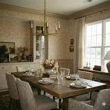 Beige fine grain wallpaper with a speckled pattern, covering the upper half of the dining room wall.