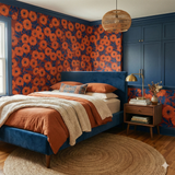 Floral wallpaper with orange and navy design, displayed on the wall behind a bed.