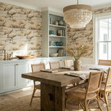 Marshwalk wallpaper with crane motif, over built-in cabinets in dining room with a wood table.