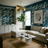 Caspian sink wallpaper with a blue, green, and tan marbled pattern, covering an accent wall in a modern living room.