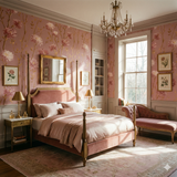 Rosette Emberfield wallpaper with pink floral pattern on a traditional style bedroom wall.