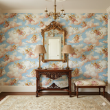 Patterned wallpaper with a cherub design on a light blue sky background.
