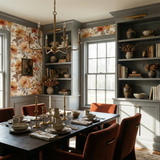 Septembre Blush Wallpaper with a floral pattern, covering a dining room wall.