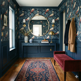 Blue Nightgarden Aviary Wallpaper with bird and botanical print, covering walls in a traditionally styled hallway.