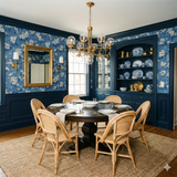 Arbor Row Wallpaper with a blue floral pattern on the wall of a dining room.
