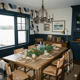 Loon themed modern wallpaper with tan and blue patterns above a dark blue paneled wall.
