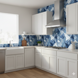 Frostvein wallpaper with blue geometric patterns, by Wallshoppe, visible in a kitchen setting.
