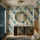 Botanical Eucalyptus Haze Wallpaper with a green leaf pattern, covering a hallway with decor.
