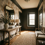 Leafpress wallpaper with foliage pattern, Hearthborn design featuring brown and beige tones, as seen in a hallway setting.