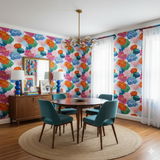 Floral chrysanthemum sonata wallpaper with bright colors and pattern, covering the walls in an eclectic dining room.
