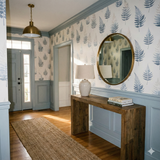Mistfell Fernway wallpaper with blue fern pattern, covering the top half of the wall above a light blue wainscotting.