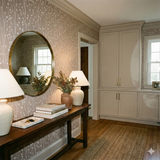 Willowdusk Sprigs Wallpaper with a taupe background and a white sprig pattern, covering the wall in an interior setting.
