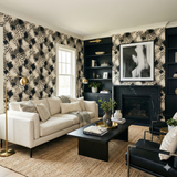 Smokeveil Savannah wallpaper with a bold, neutral animal print, in a stylish living room setting.
