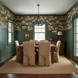 Duckhaven wallpaper featuring a dog and duck motif, applied on the top half of a dining room wall.

