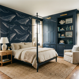 Pelagic Lineage Wallpaper with whale pattern background, marine theme in a stylish bedroom setting.