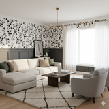 Ashgrove Wallpaper in black and white, featuring a leaf pattern with dark gray accent wall paneling.