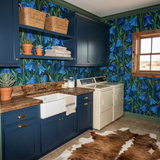 Floral curtain wallpaper in blue by unknown vendor, showcased in a laundry room with bright blue cabinetry.
