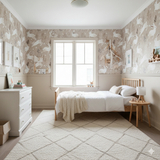 Willow & Thistle wallpaper featuring rabbit and plant pattern, covering the walls in a neutral children's bedroom.