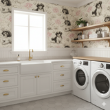 Lotus Companion Wallpaper featuring a beige background with black and pink dog and lotus pattern.
