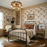 Prairie Reliquary wallpaper featuring a longhorn skull pattern, with a vintage, Western-themed room setting.