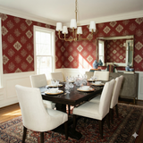 Red and beige patterned wallpaper with a medallion design.