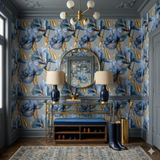 Celestine Gilded Iris wallpaper with blue and gold floral pattern, decorating a hallway with console table, lamps, mirror, and shoes.
