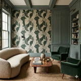 Green and beige leaf pattern wallpaper, with green trim, and a matching bookcase.
